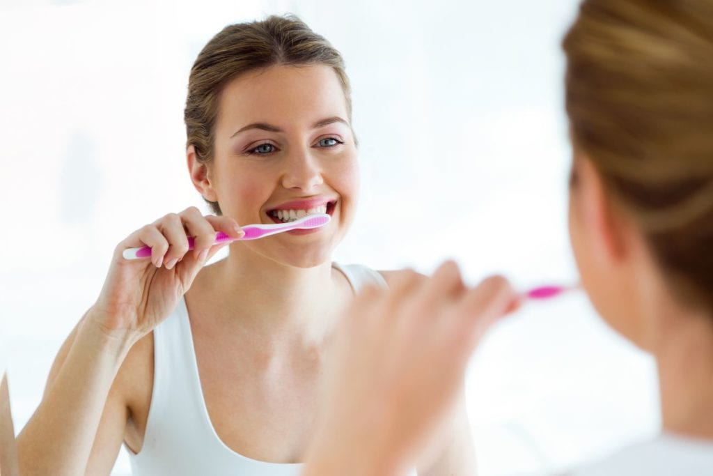 brushing your teeth in McLeansville North Carolina